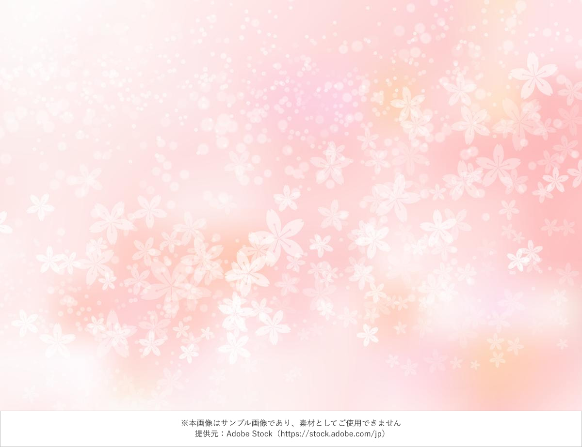 桜の花が舞う淡いピンクの春背景